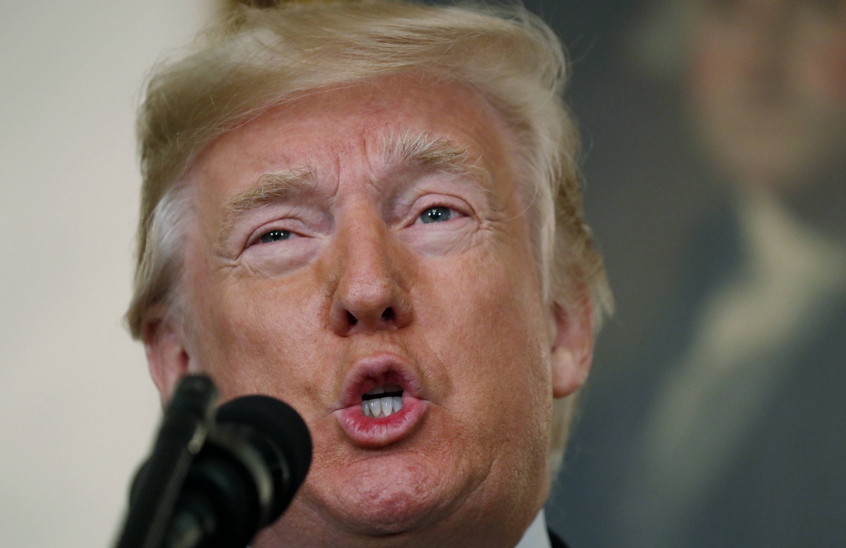 U.S. President Donald Trump makes a statement on the mass shooting in Las Vegas in front of a portrait of President George Washington in the Diplomatic Room at the White House in Washington, U.S., October 2, 2017. REUTERS/Kevin Lamarque