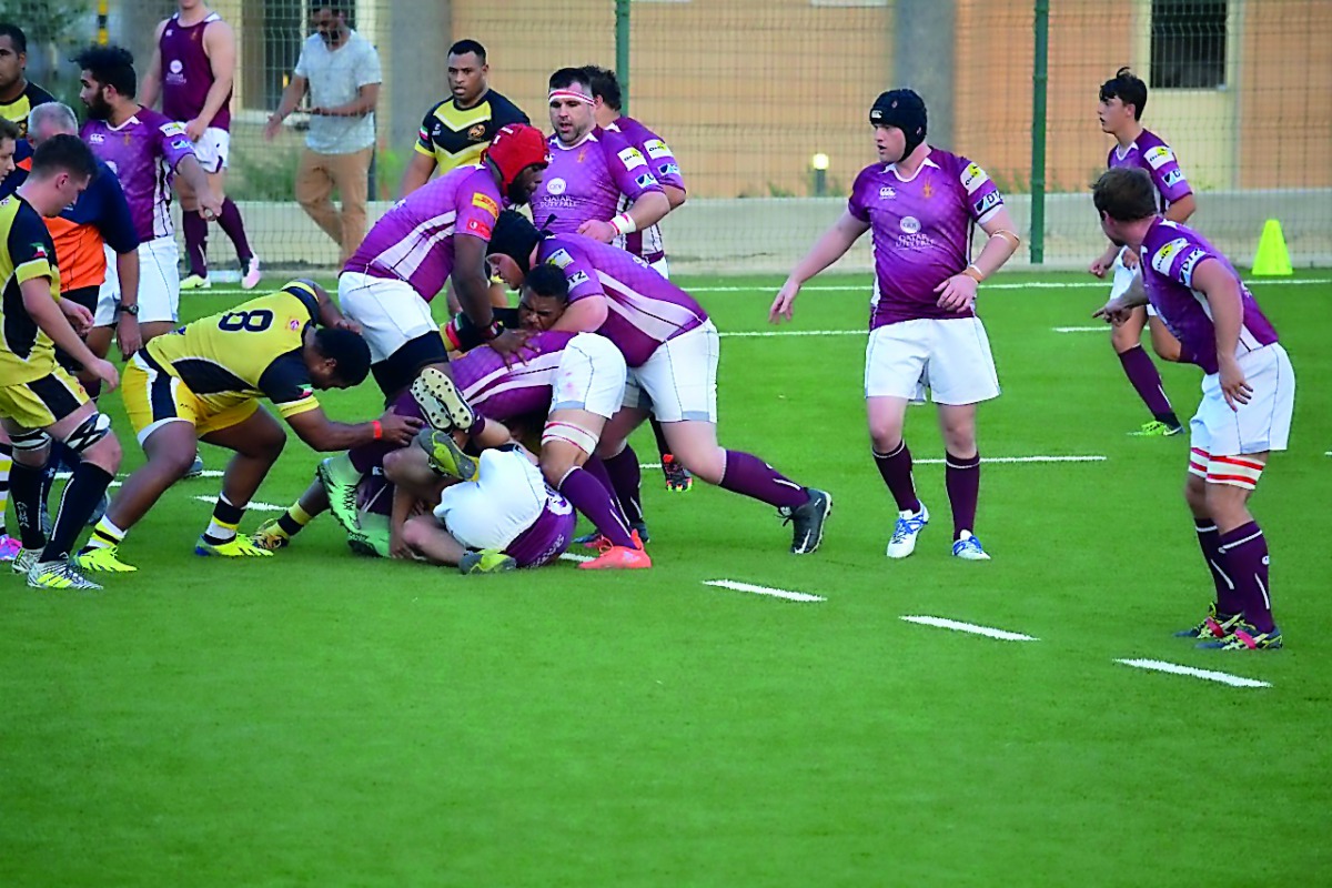 Doha RFC players fight for ball possession with Kuwait Scorpions RFC in their Gulf Conference League game in Kuwait.