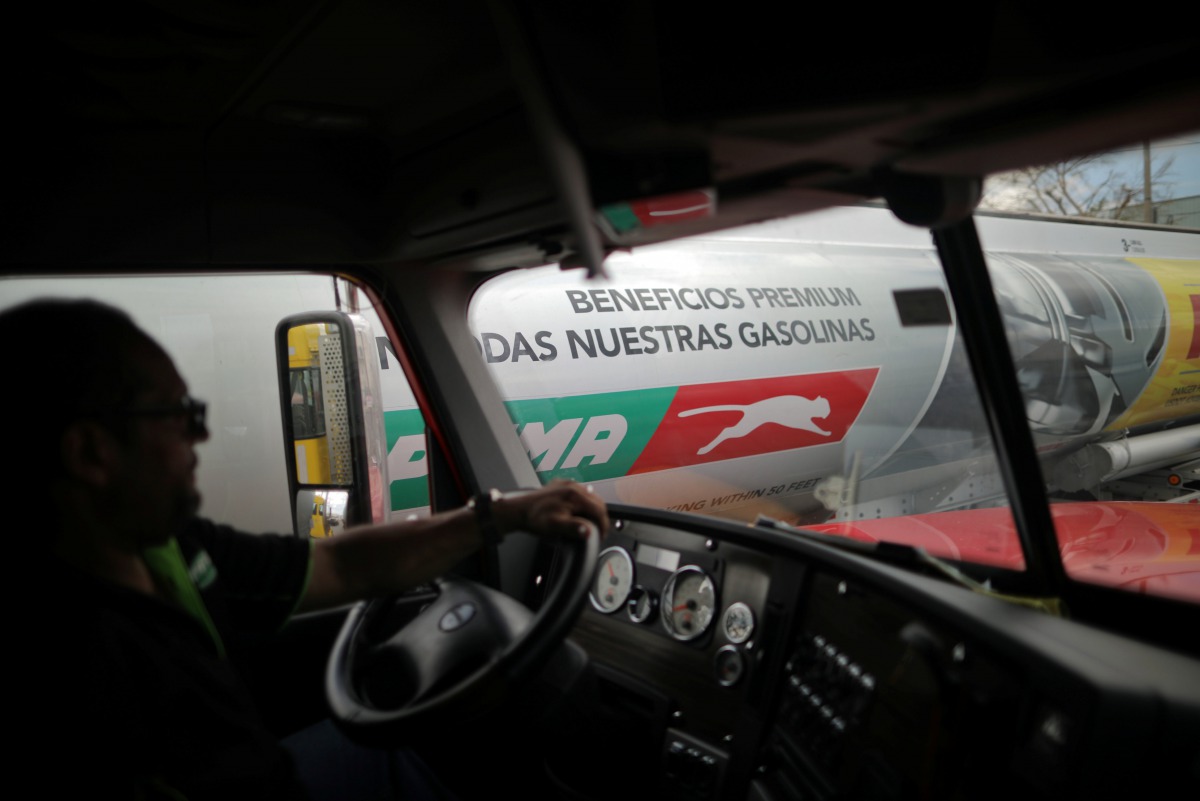 A gas truck departs an operational headquarters to deliver gasoline following Hurricane Maria in San Juan, Puerto Rico, October 2, 2017. REUTERS/Carlos Barria
