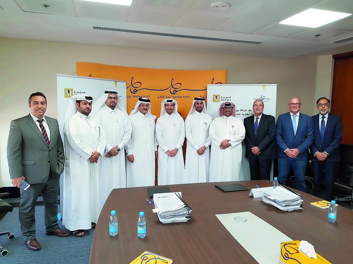Officials of MEEZA and Q-Post during the launch of the partneship. 
