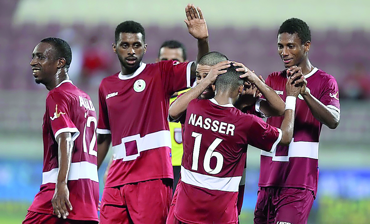 Al Markhiya players celebrate their 2-0 win over Al Sadd on day two of the QSL Cup on Wednesday. 