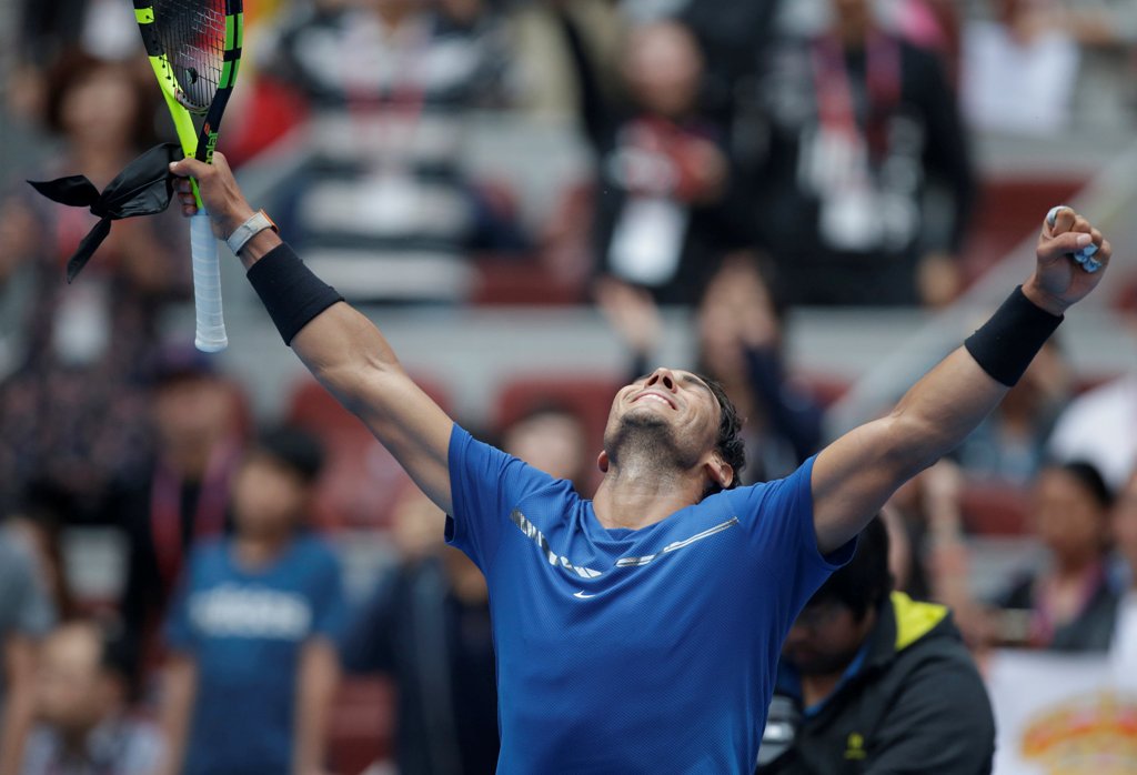 Rafael Nadal of Spain celebrates his win against John Isner of the U.S.. REUTERS/Jason Lee
