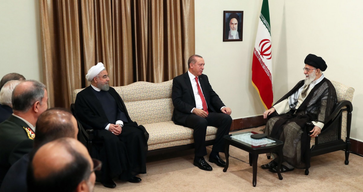 A handout photo provided by the office of Iran supreme leader Ayatollah Ali Khamenei shows him and President Hassan Rouhani meeting with Turkish President Recep Tayyip Erdogan on October 4, 2017 (AFP) 