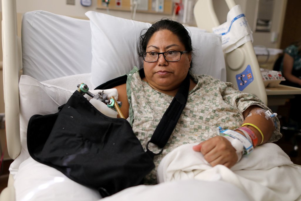 FILE PHOTO: Paola Bautista, 39, from Fontana, California, sits in her hospital bed at Sunrise Hospital & Medical Center after being shot at the Route 91 music festival mass shooting next to the Mandalay Bay Resort and Casino in Las Vegas, Nevada, U.S. Oct