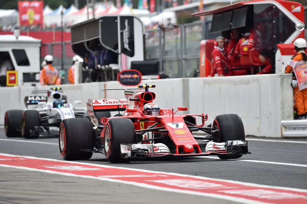 Ferrari's Finnish driver Kimi Raikkonen drives in the pit lane during the third practice session of the Formula One Japanese Grand Prix at Suzuka on October 7, 2017. / AFP / KAZUHIRO NOGI
