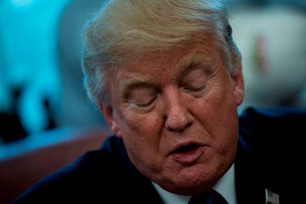 US President Donald Trump speaks about business during a proclamation signing in the Oval Office of the White House October 6, 2017 in Washington, DC. / AFP / Brendan Smialowski
