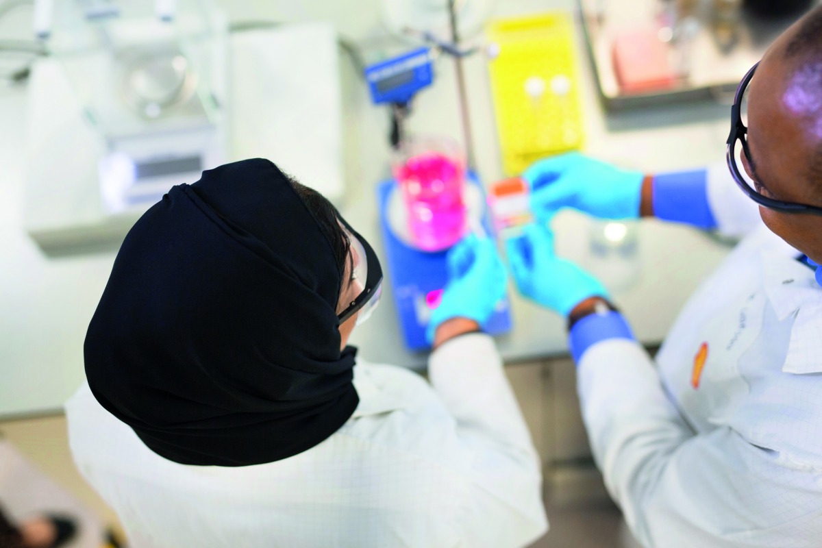 Researchers at Qatar Shell Research and Technology Centre during an experiment. 