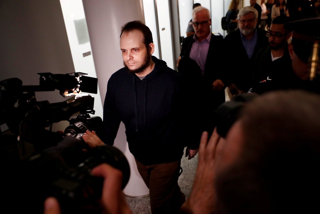 Joshua Boyle walks through the airport after arriving with his wife and three children at Toronto Pearson International Airport, nearly 5 years after he and his wife were abducted in Afghanistan in 2012 by the Taliban-allied Haqqani network, in Toronto, O