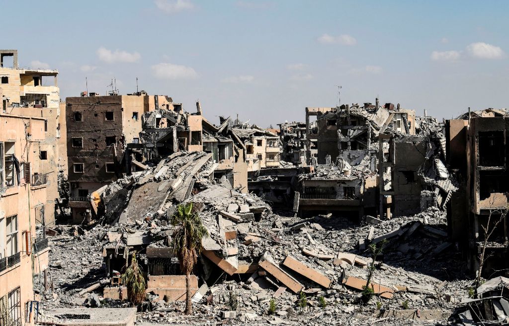 (FILES) This file photo taken on October 01, 2017 shows the damage near the central hospital of the embattled northern Syrian city of Raqa. AFP / BULENT KILIC