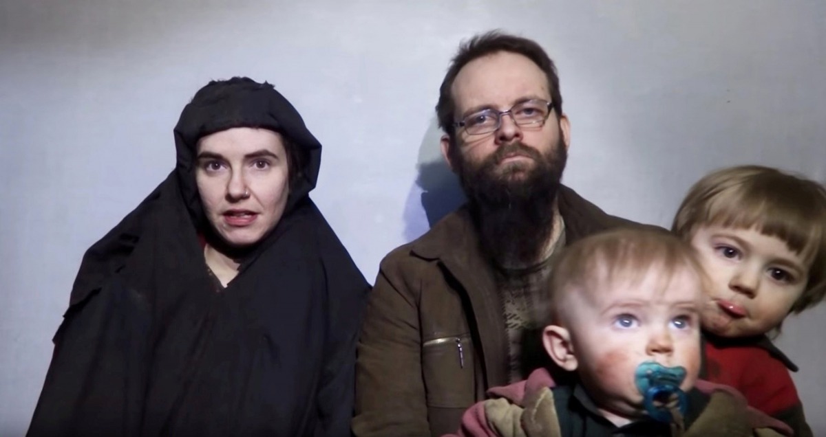 A still image from a video posted by the Taliban on social media on December 19, 2016 shows American Caitlan Coleman speaking next to her Canadian husband Joshua Boyle and their two sons (Taliban / via Reuters) 