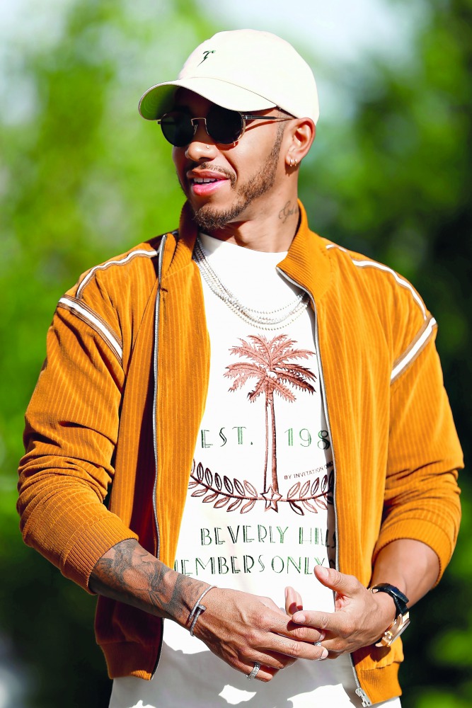 Lewis Hamilton of Great Britain and Mercedes GP walks in the paddock during previews ahead of the United States Formula One Grand Prix at Circuit of The Americas in Austin, Texas. 