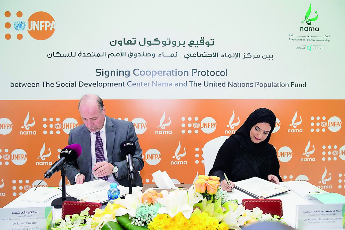 NAMA Center’s Acting Executive-Manager, Maryam bint Abdullatif Al Mannai, signs the agreement with the UNFPA Director for the Arab States Regional Office, Dr. Luay Shabaneh, at NAMA Center’s headquarters. 