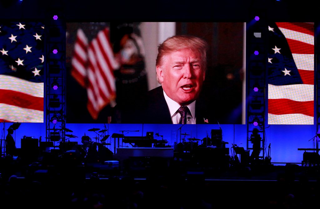 President Donald Trump in a video message as five former U.S. presidents, attended a concert at Texas A&M University benefiting hurricane relief efforts in College Station, Texas, U.S., October 21, 2017. REUTERS/Richard Carson