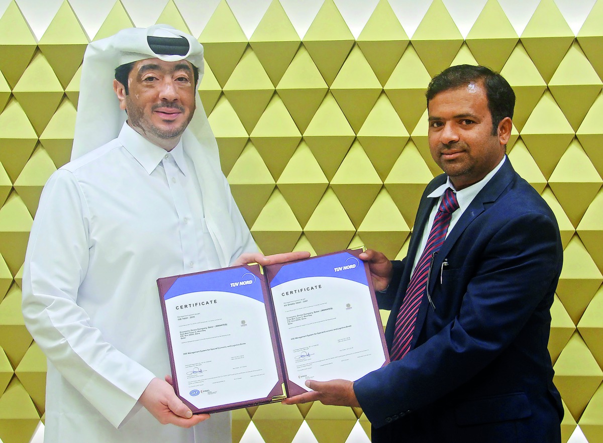 Fahad Rashid Al Kaabi (left), CEO of Manateq, receiving the ISO certificates.