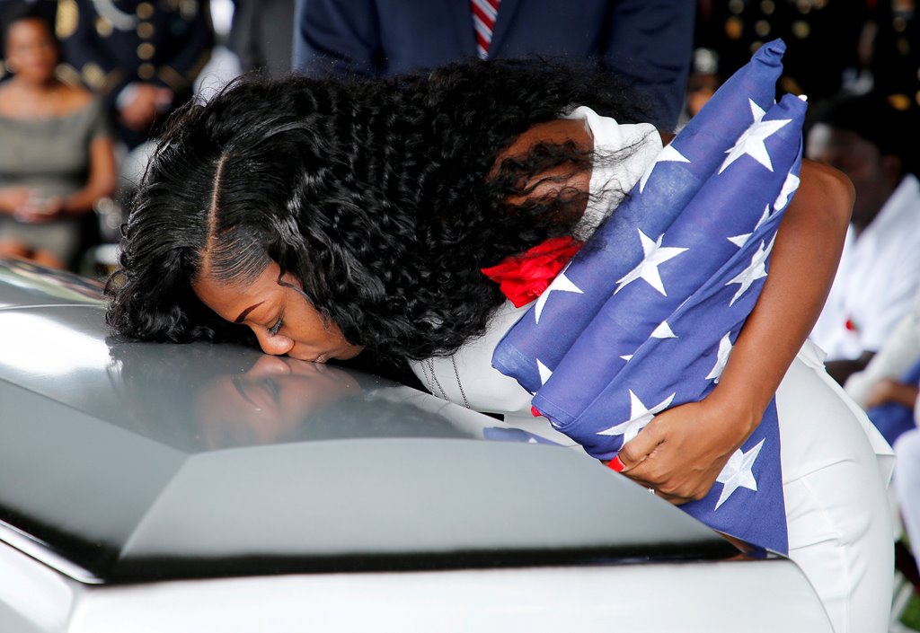FILE PHOTO: Myeshia Johnson, wife of U.S. Army Sergeant La David Johnson, who was among four special forces soldiers killed in Niger, kisses his coffin at a graveside service in Hollywood, Florida, October 21, 2017. REUTERS/Joe Skipper/File Photo
