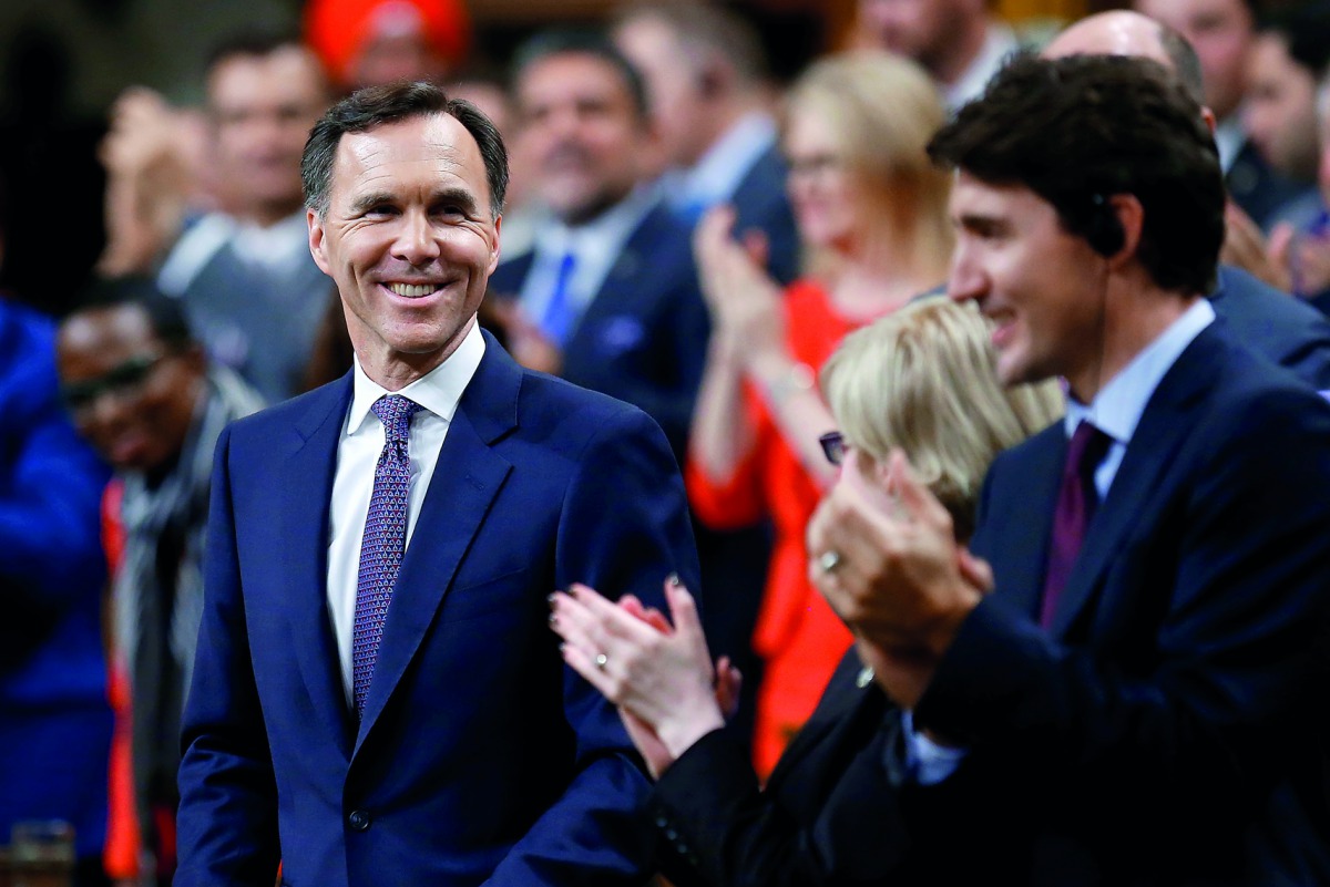Canada's Finance Minister Bill Morneau receives a standing ovation before delivering the Fall Economic Statement in the House of Commons on Parliament Hill in Ottawa, Ontario, Canada October 24, 2017. Reuters/Chris Wattie