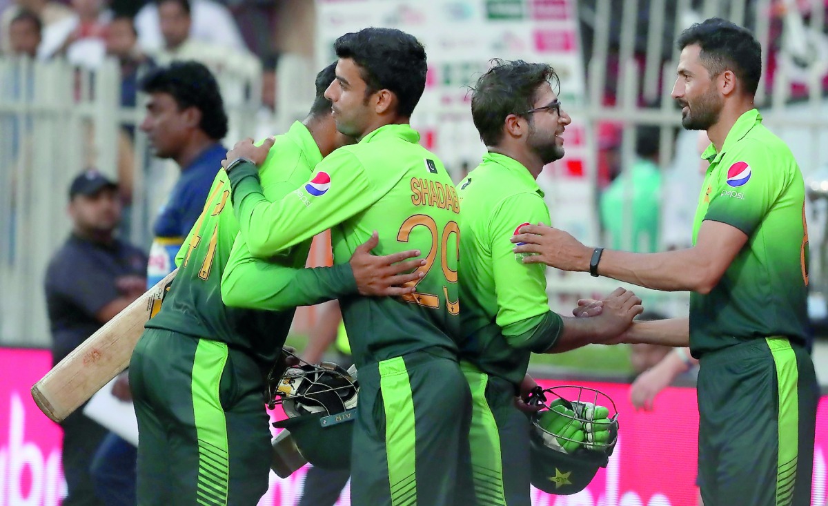 Pakistani cricketers celebrate their victory at the end of the fifth one day international match against Sri Lanka at Sharjah Cricket Stadium in Sharjah, UAE in this file photo.