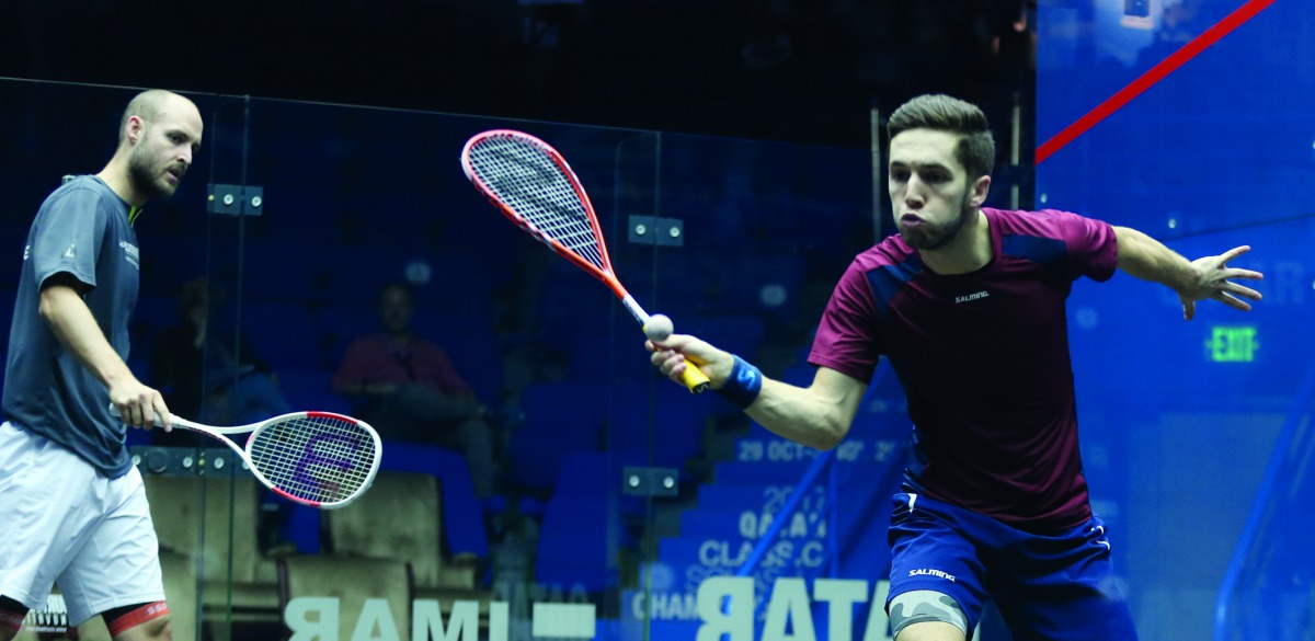 Nicolas Mueller (left) of Switzerland and Ben Coleman of England in action during the qualifying rounds of the Qatar Classic at the Khalifa International Tennis and Squash Complex yesterday. Mueller won 11-9, 8-11, 8-11, 11-1, 11-8.