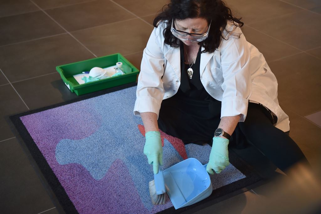 This photo taken on September 28, 2017 shows Australian space archaeologist Alice Gorman sweeping the 