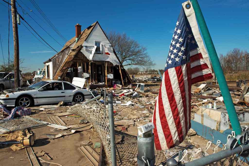 A file photo of a house seen with its entire first floor washed away, as well as the entire surrounding area demolished when Hurricane Sandy hit the coastal estuary in the Oakwood Beach area of Staten Island, New York, November 6, 2012. AFP / Paul J.RICHA