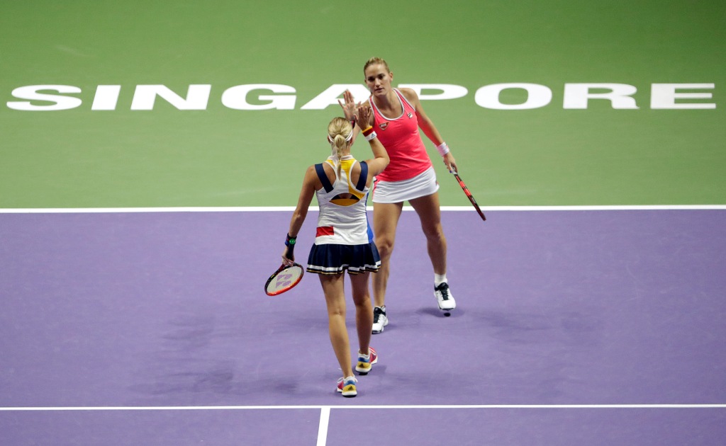 Timea Babos of Hungary and Andrea Hlavackova of the Czech Republic celebrate during their doubles finals match against Kiki Bertens of the Netherlands and Johanna Larsson of Sweden REUTERS/Jeremy Lee
