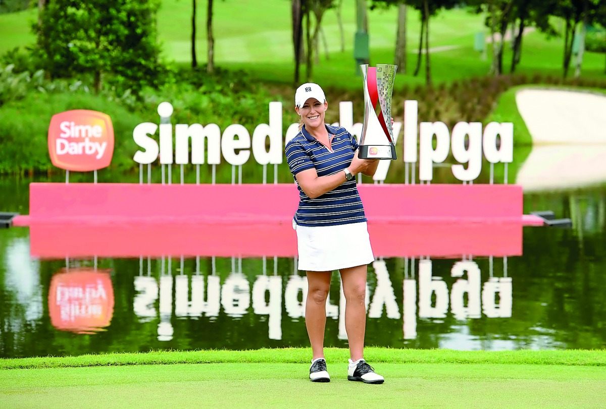 Cristie Kerr of the US holding the trophy after winning the LPGA Malaysia in Kuala Lumpur yesterday.