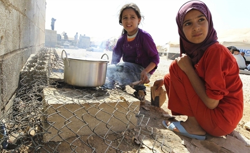 A file photo of Syrian children at school in a refugee camp in Jordan. Reuters.