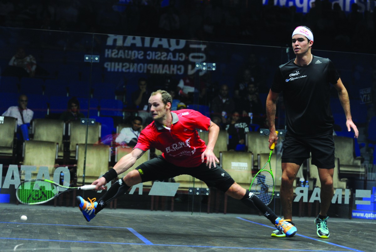 Gregory Gaultier (left) of France in action against Diego Elias of Peru during their Qatar Classic quarter-final match played at the Khalifa International Tennis and Squash Complex in Doha Yesterday. Gaultier eased into today’s semi-finals after beating t
