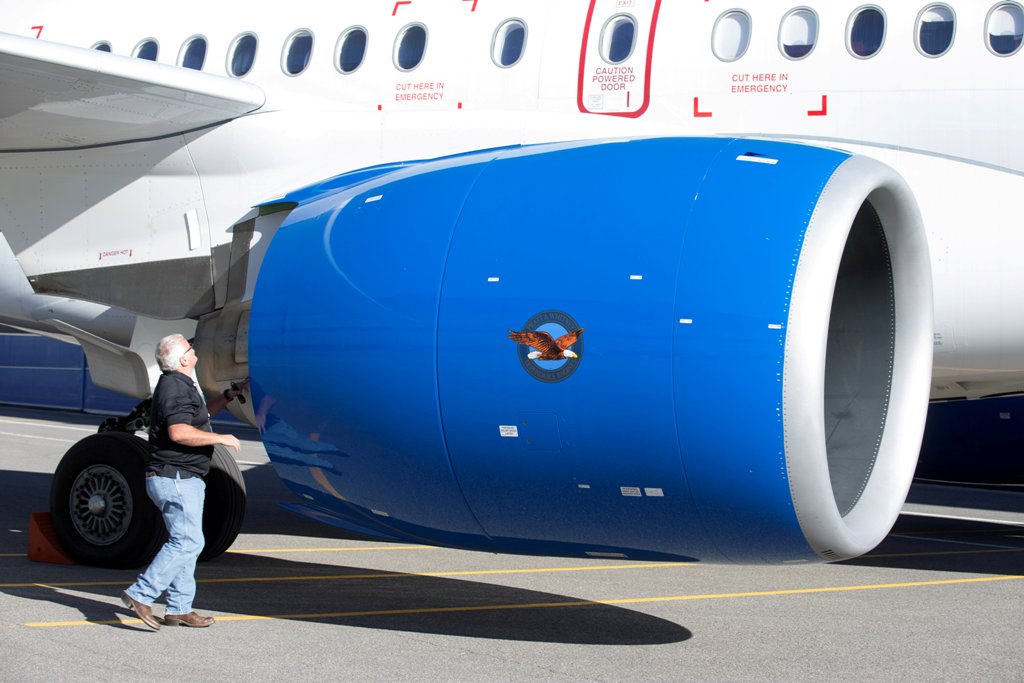 FILE PHOTO: An employee inspects the engine of a C Series plane at Bombardier's plant in Mirabel, Quebec Canada, October 20, 2017. REUTERS/Christinne Muschi/File Photo
