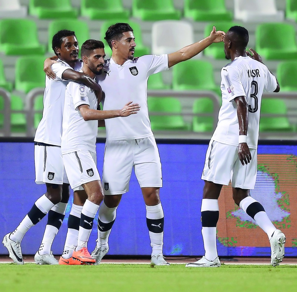 Al Sadd’s players celebrate a goal against Al Ahli during their QNB Stars League match at Khalifa Stadium yesterday. Al Sadd won the match 2-1.