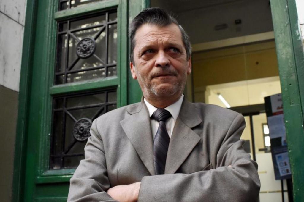 Professor Ricardo Berlot, who was a teacher of the five Argentine citizens of Rosario who were killed, reacts as he talks to journalists outside the Instituto Politecnico in Rosario, Argentina. REUTERS/Stringer.