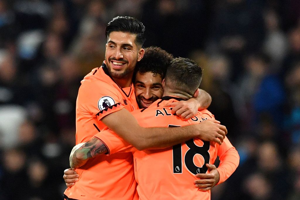 Liverpool's Egyptian midfielder Mohamed Salah (C) celebrates after scoring with Liverpool's German midfielder Emre Can (L) and Liverpool's Spanish defender Alberto Moreno during the English Premier League football match between West Ham United and Liverpo