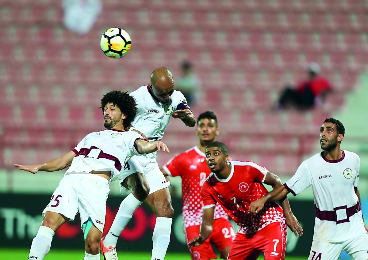 Al Markhiya and Al Arabi players vie for the ball possession during their Group B QSL Cup match played at Al Shamal Stadium in this October 10 file picture.