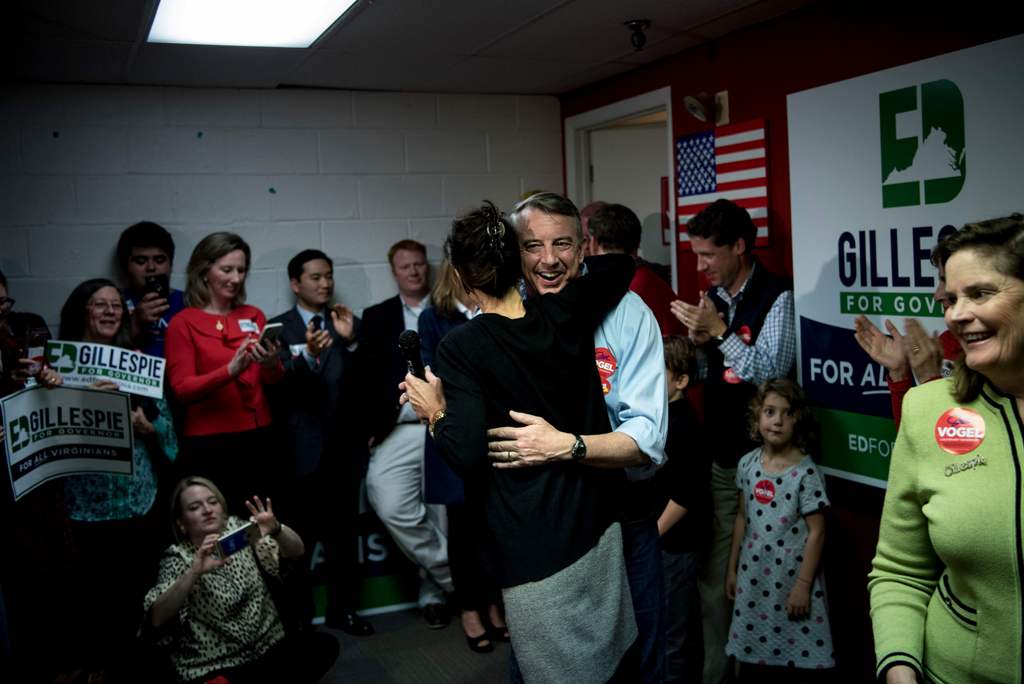 Virginia Republican gubernatorial hopeful Ed Gillespie hugs Jill Vogel, Republican nominee for lieutenant governor, during a rally on the eve of state elections, seen as a big test for US President Donald Trump, November 6, 2017 in Fairfax, Virginia. / AF