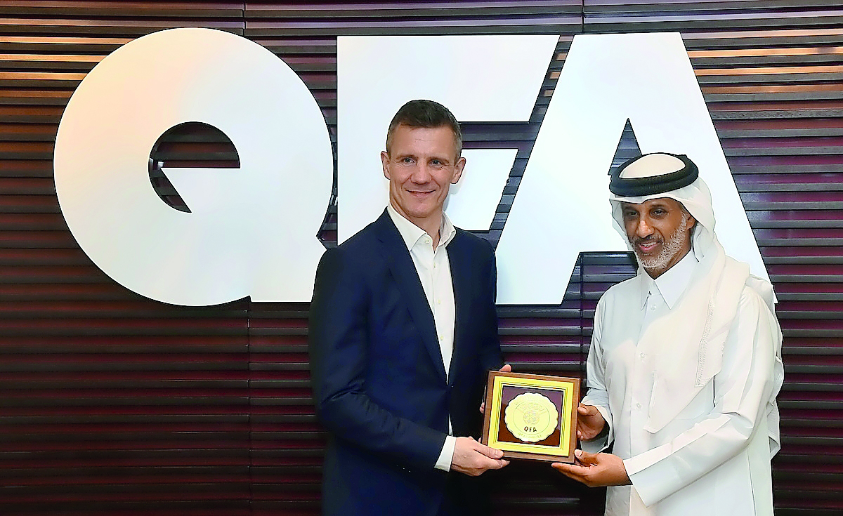 The President of the Qatar Football Association (QFA), Sheikh Hamad bin Khalifa bin Ahmed Al Thani hands over a memento to President of the Football Association of Iceland, Gudni Bergsson in Doha yesterday.