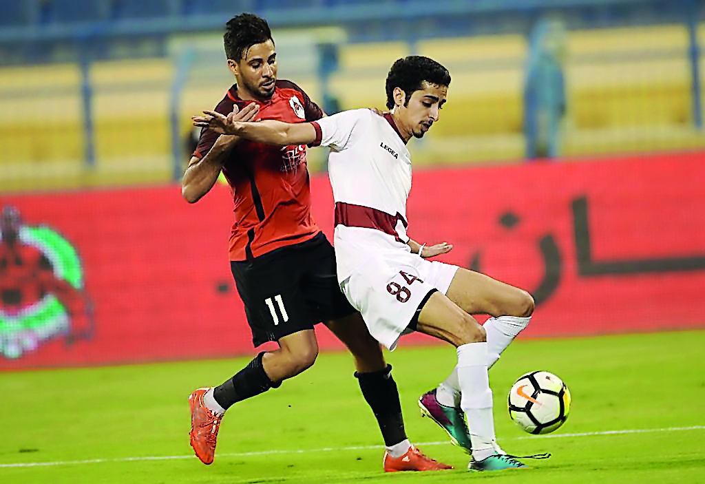 Action from the QSL Cup match of Group B between leaders Al Rayyan and Al Markhiya at Al Gharafa Stadium yesterday.