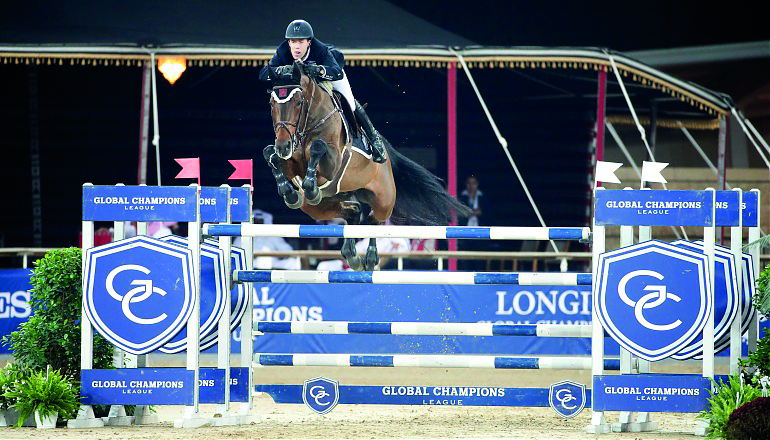 Dutch rider Maikel van der Vleuten guides VDL Groep Verdi Tn over an obstacle during the 1.50/1.55m class event on day one of the Longines Global Champions Tour (LGCT) at Al Shaqab Arena yesterday. 
