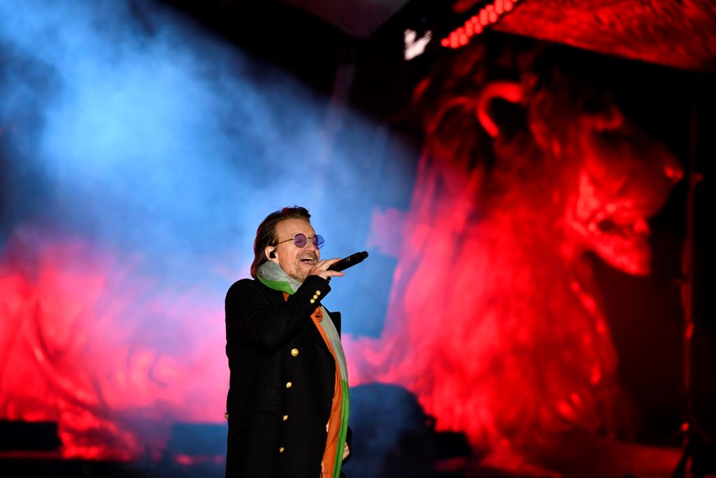Bono of Irish rock band U2 performs with his band on stage in Trafalgar Square in central London on November 11, 2017 during the 