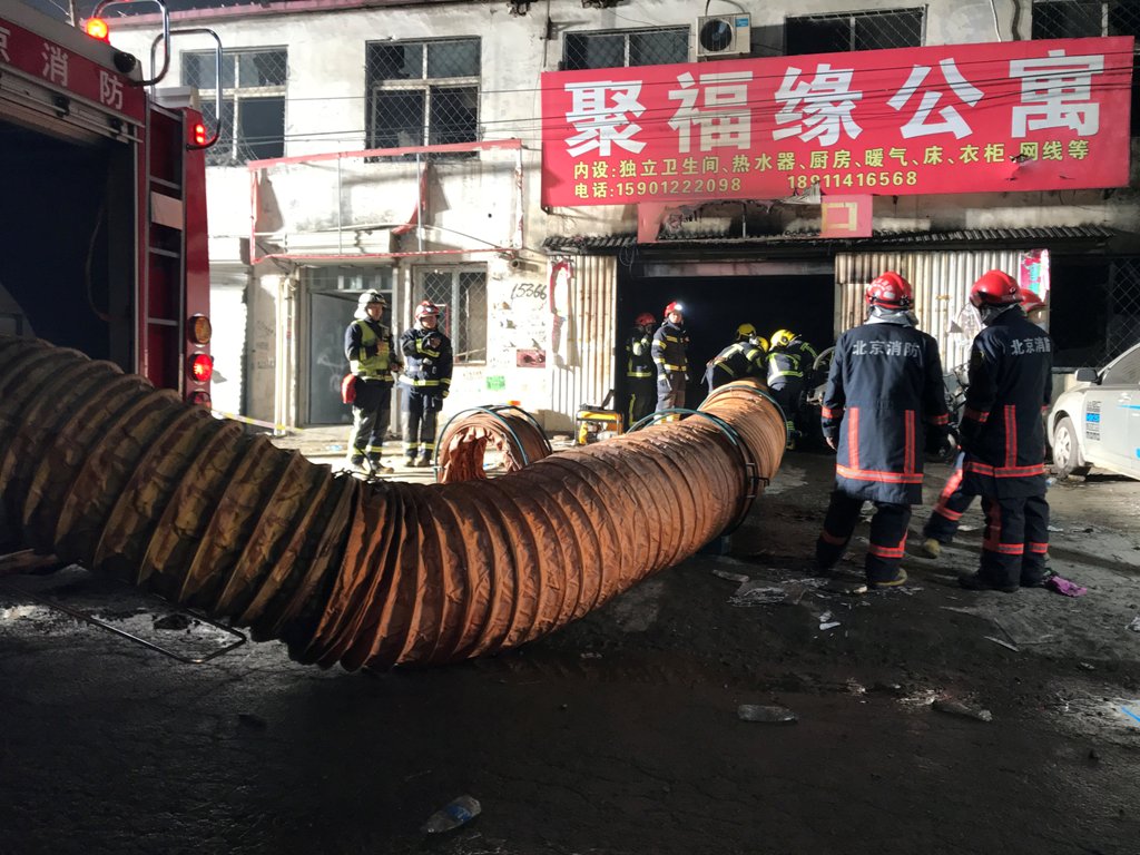 Firefighters work at the site of a house fire, in Daxing district, Beijing, China early November 19, 2017. REUTERS/Stringer 