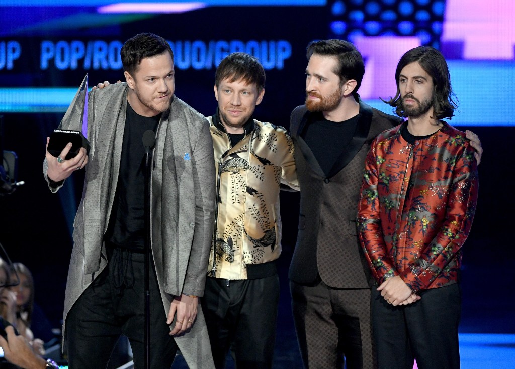 (L-R) Dan Reynolds, Ben McKee, Daniel Platzman, and Wayne Sermon of music group Imagine Dragons accept the Favorite Duo or Group - Pop/Rock award onstage during the 2017 American Music Awards at Microsoft Theater on November 19, 2017 in Los Angeles, Calif