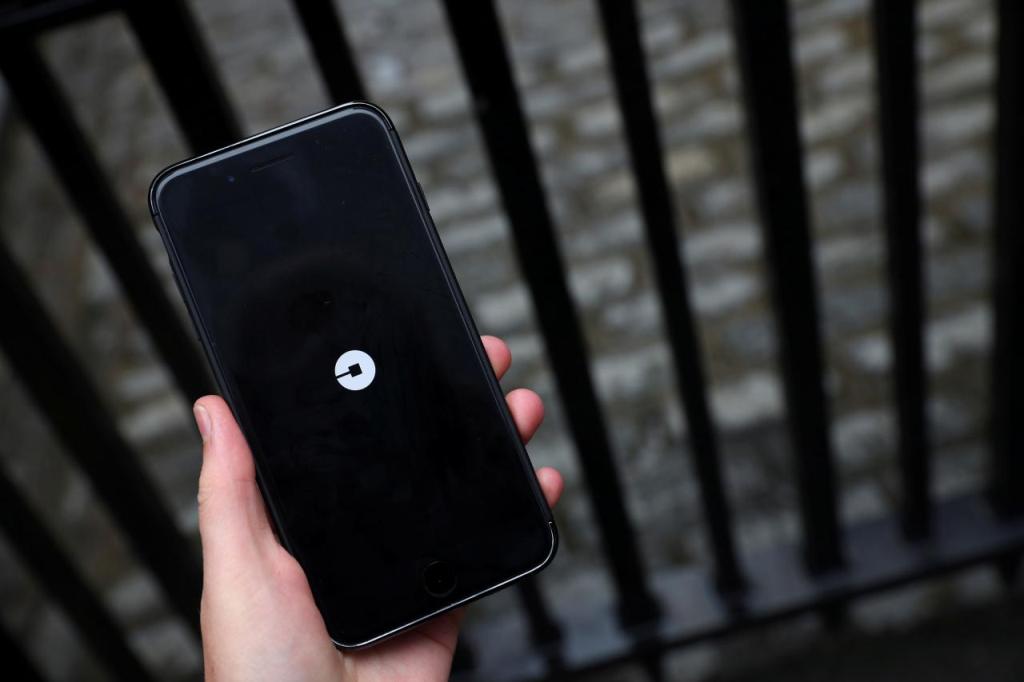 The Uber logo is seen on mobile phone. REUTERS/Hannah McKay 