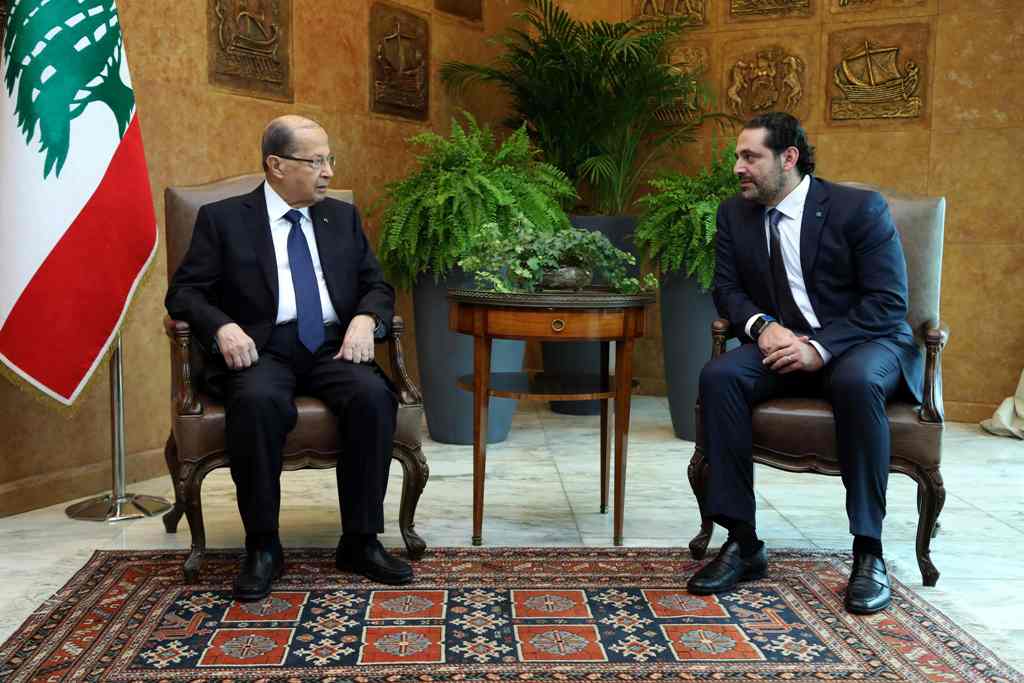 A handout picture provided by the Lebanese photo agency Dalati and Nohra on November 22, 2017 shows Lebanese prime minister Saad Hariri meeting with President Michel Aoun at the presidential palace in Baadba, on the outskirsts of the Lebanese capital Beir