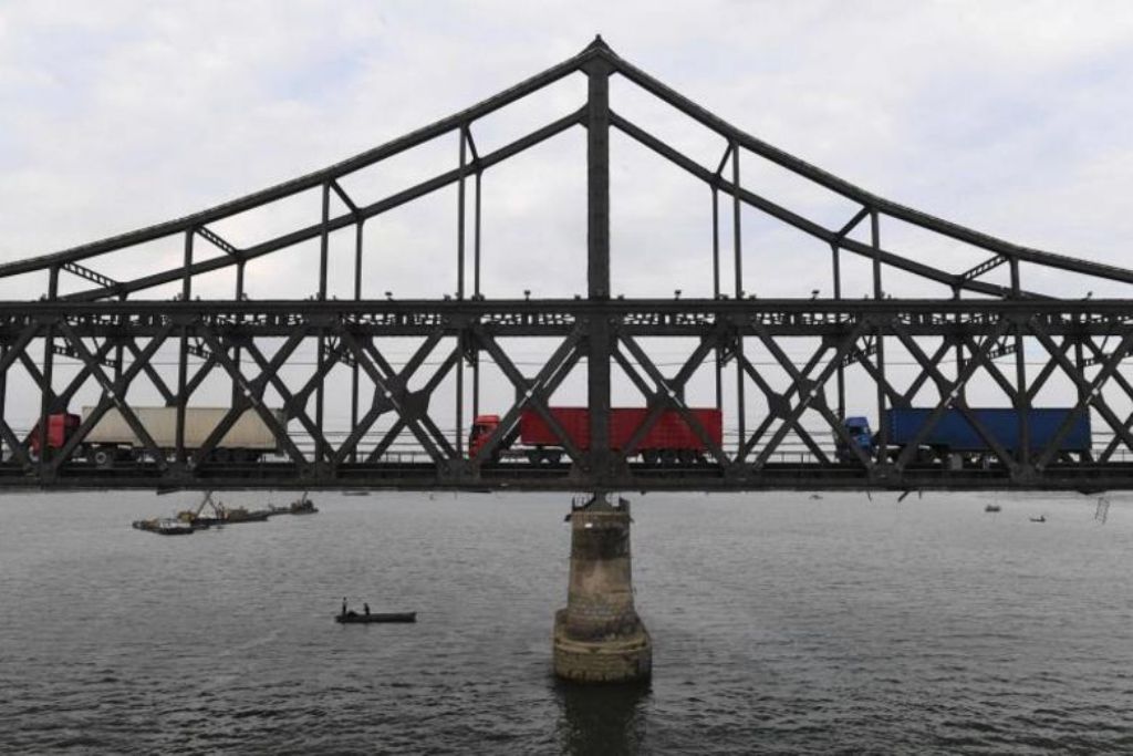A file photo of the trucks returning over the Friendship Bridge from the North Korean town of Sinuiju to the Chinese border city of Dandong in Liaoning province. AFP.