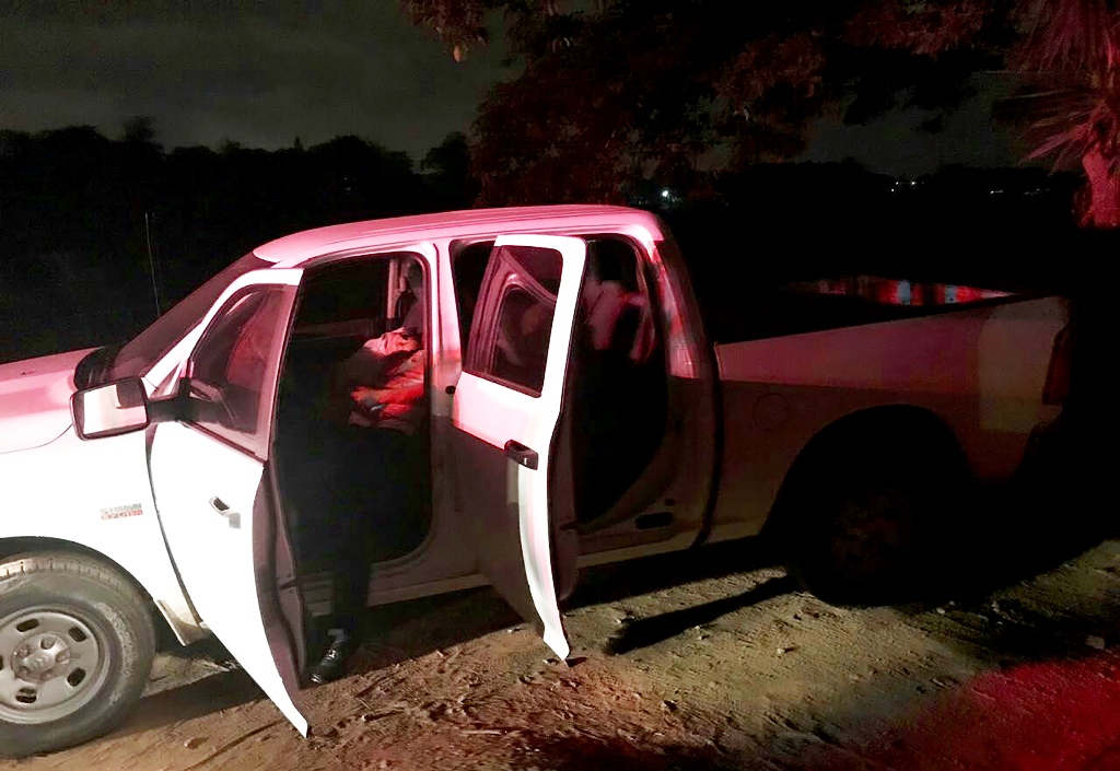 A handout photo released by the State Police of Xalapa, Veracruz, shows the truck with the corpses of the mayor of Ixhutlan de Madero, Victor Manuel Espinoza Tolentino and his wife Irma Carrera Tinoco on a road between Banderilla and Xalapa, Veracruz stat