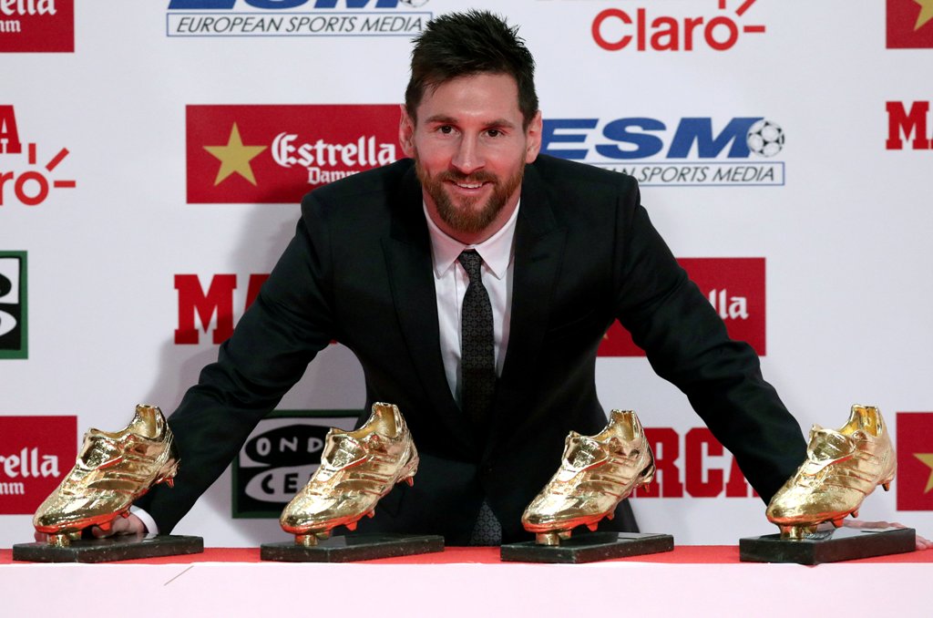 Barcelona's Lionel Messi poses with his four Golden Boot trophies during a ceremony in Barcelona, Spain, November 24, 2017. REUTERS/Albert Gea TPX IMAGES OF THE DAY
