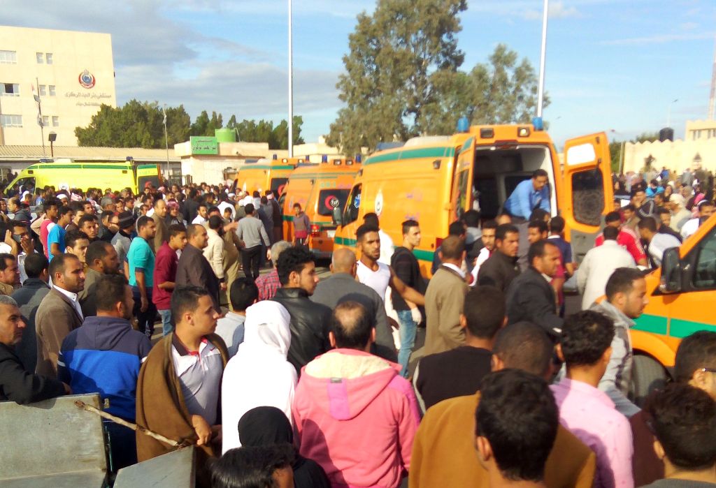 Egyptians gather around ambulances following a gun and bombing attack on the Rawda mosque near the North Sinai provincial capital of El-Arish on November 24, 2017.  AFP 
