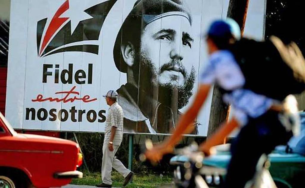 A man walks past a poster of late Cuban leader Fidel Castro in Havana. (YAMIL LAGE/AFP).