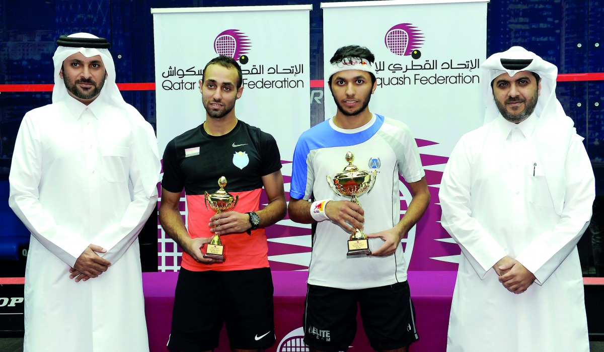 FROM LEFT: Tournament Director Saad Al Mohannadi, Egyptian player and runner-up Karim El Hammamy, Champion Qatari player Abdulla Al Tamimi and Qatar Tennis, Squash and Badminton Federation General Secretary Tariq Darwish Zainal pose for a photograph follo