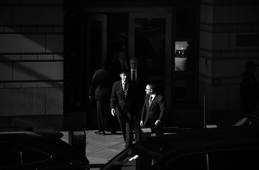 WASHINGTON, DC - DECEMBER 01: (EDITORS NOTE: Image has been converted to black and white.) Michael Flynn, former national security advisor to President Donald Trump, leaves following his plea hearing at the Prettyman Federal Courthouse December 1, 2017 in