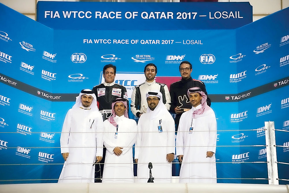 Podium winners of Race 2 in the opening round of the Qatar Touring Car Championship (QTTC), Saadon Al Kuwari (top left), Abdulla Ali Al Khelaifi (top centre) and Adham Maged Eldib pose for a photograph with QMMF President Abdulrehman Al Mannai (third left